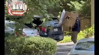FBI agents leave John Bolton’s home carrying boxes of evidence.