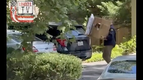 FBI agents leave John Bolton’s home carrying boxes of evidence.