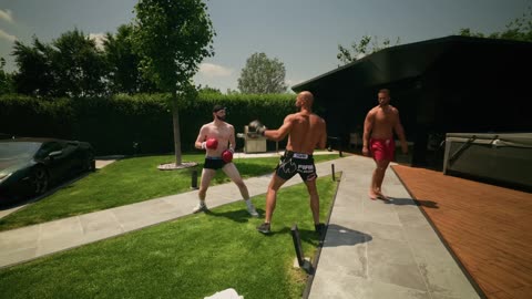 Andrew Tate spars a fan