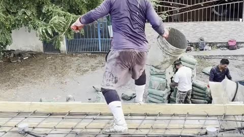 Workers Perform Stylish Flips Off Roof