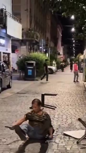 He hunts down Italians with scissors, threatens customers in a Naples bar, and receives