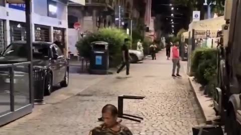 He hunts down Italians with scissors, threatens customers in a Naples bar, and receives