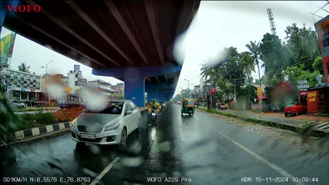 Scooter Loses Control on Wet Road