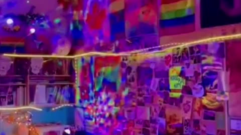 Elementary school teacher shows off all the gay flags he has in his classroom