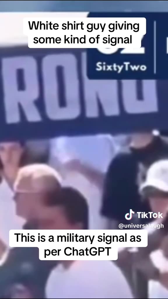 White shirt guy giving some kind of signal