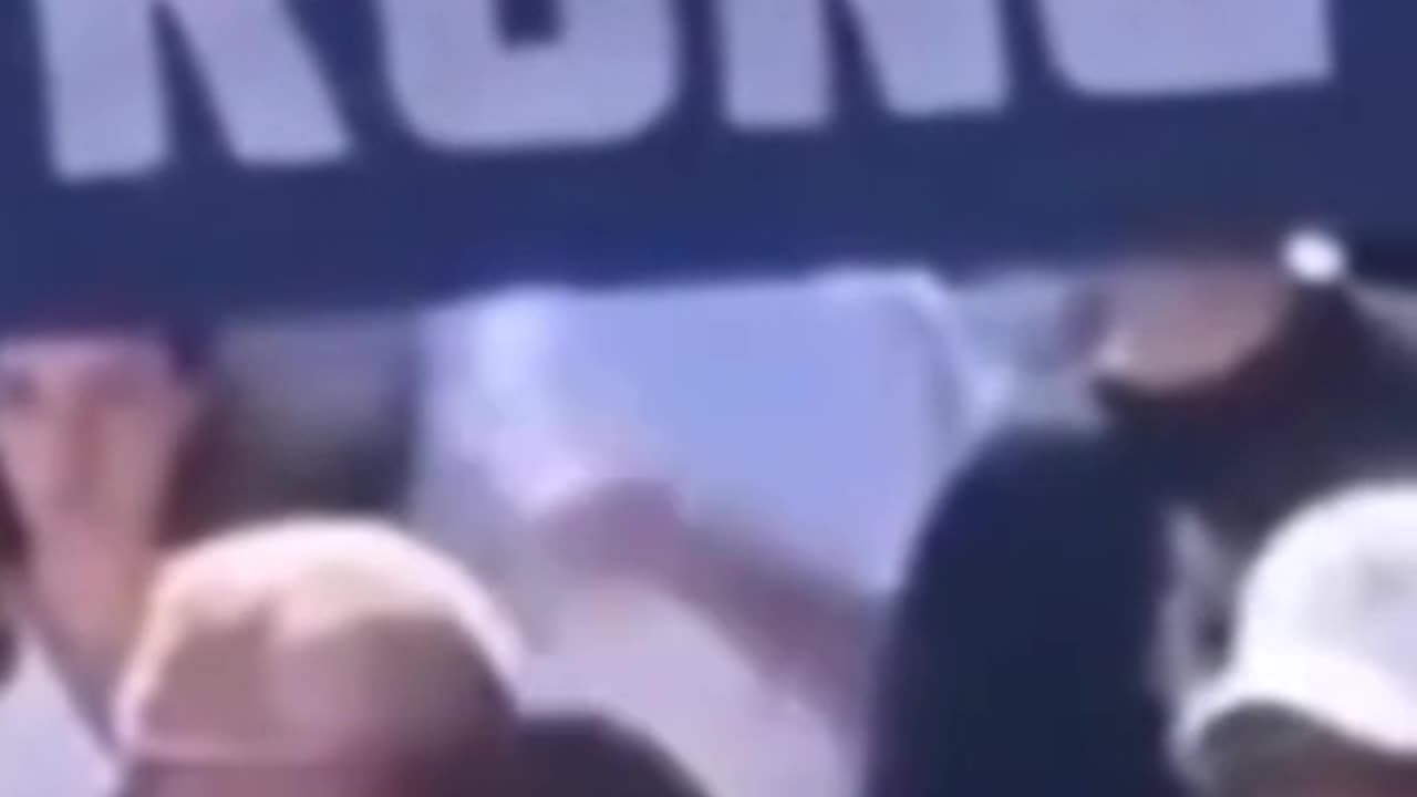 White shirt guy giving some kind of signal