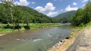 NW NC at The Treehouse 🌳 7/23/25 82°F 2:45pm Kids rafting on the North Toe River in Green Mountain