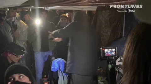Portland Police officers are raiding the Antifa supply tent next to the ICE building.