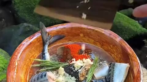 Cooking fish in the forest