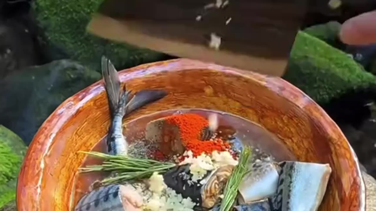 Cooking fish in the forest