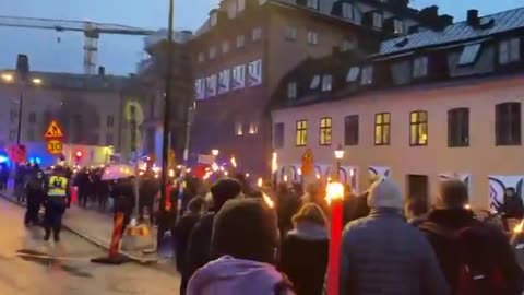 Swedish people marched in the street to protest against open borders yesterday.
