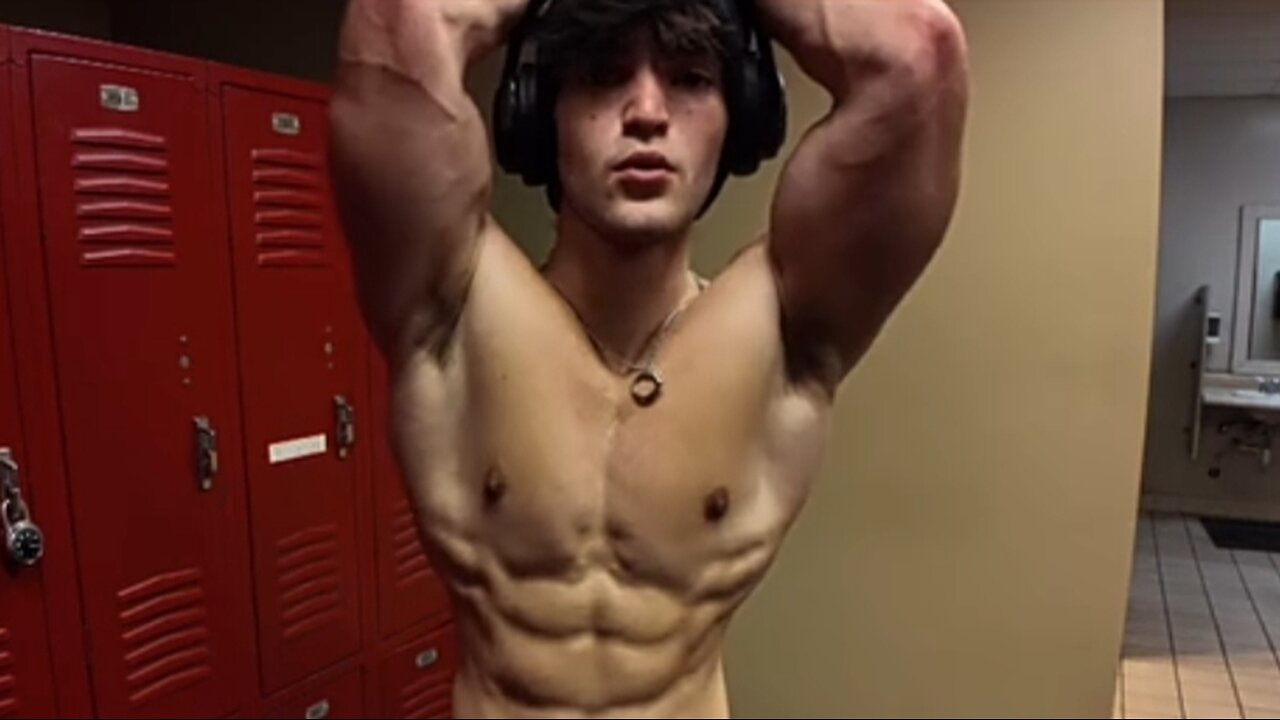 Young bodybuilder flexing his muscles
