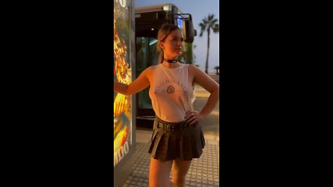 Waiting for the bus, sexy sideboob top. 