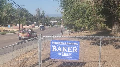 Agitating a little by a Republican sign