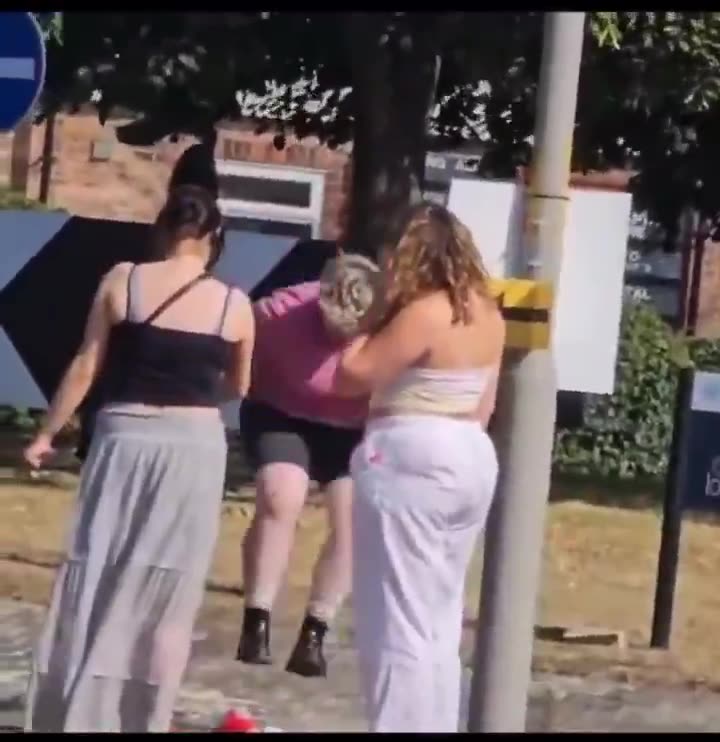 3 munters ripping down and stamping on the St Georges Cross in Ripon