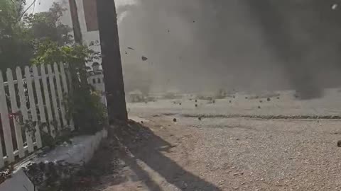 Helicopter Knocks Branches Onto Moving Vehicle During Firefighting Operation