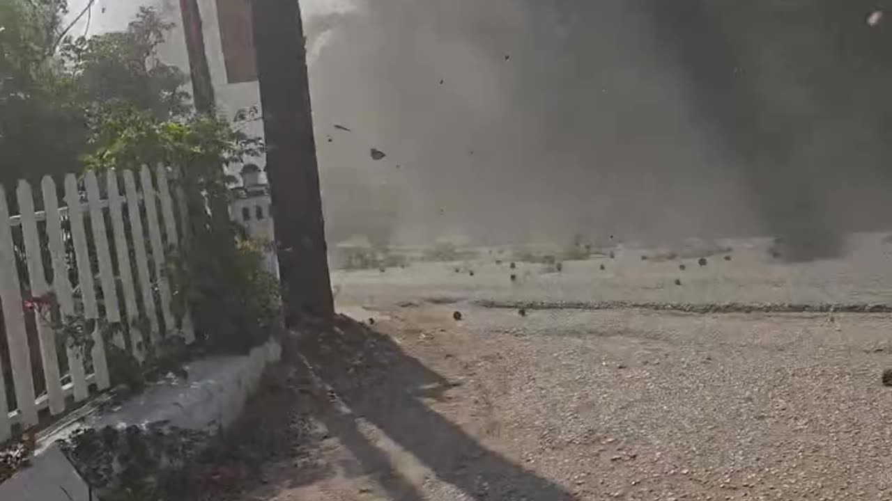 Helicopter Knocks Branches Onto Moving Vehicle During Firefighting Operation