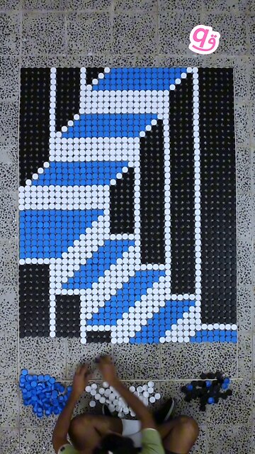 Built a #3d staircase illusion using 1,872 bottle caps! ♻️🧱