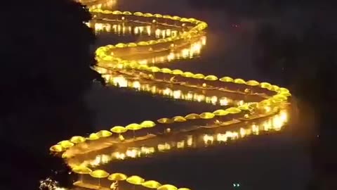 A 70-Metre Dragon Made of 80 Bamboo Rafts 🐉✨