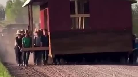 50 Amish Men and Boys Move a Farm Building Over a Mile on a Dirt Road