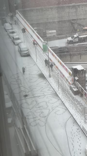 New Yorker Making Hearts in the Snow