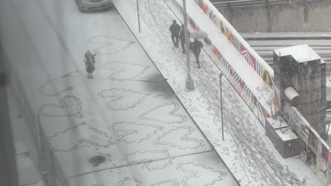 New Yorker Making Hearts in the Snow