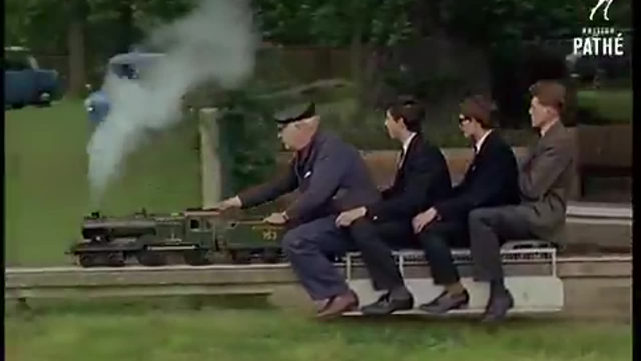 Riding a model train and feeding it coal