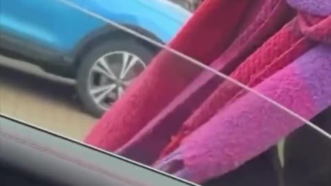 A British local asks a woman in a Burkha to move out of a disabled parking spot
