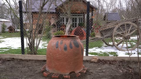 Tandoor Oven - Built and Cooking Lamb and Vegetables Inside