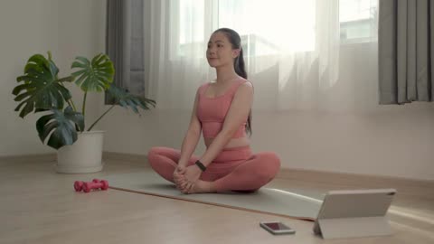 Asian Woman, post workout, stretching