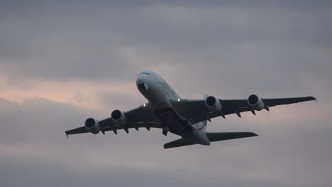 A380-800 of Emirates Airlines soars into the gloomy autumn sky over Moscow