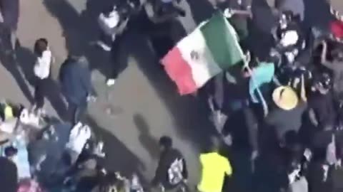 Anti-ICE protesters are assaulting an adult man in civilian clothing in Southern California