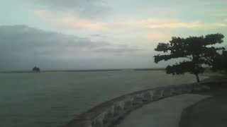 A wonderful view of the sea coast at dusk, beach, buildings, boats and an island! [Nature & Animals]