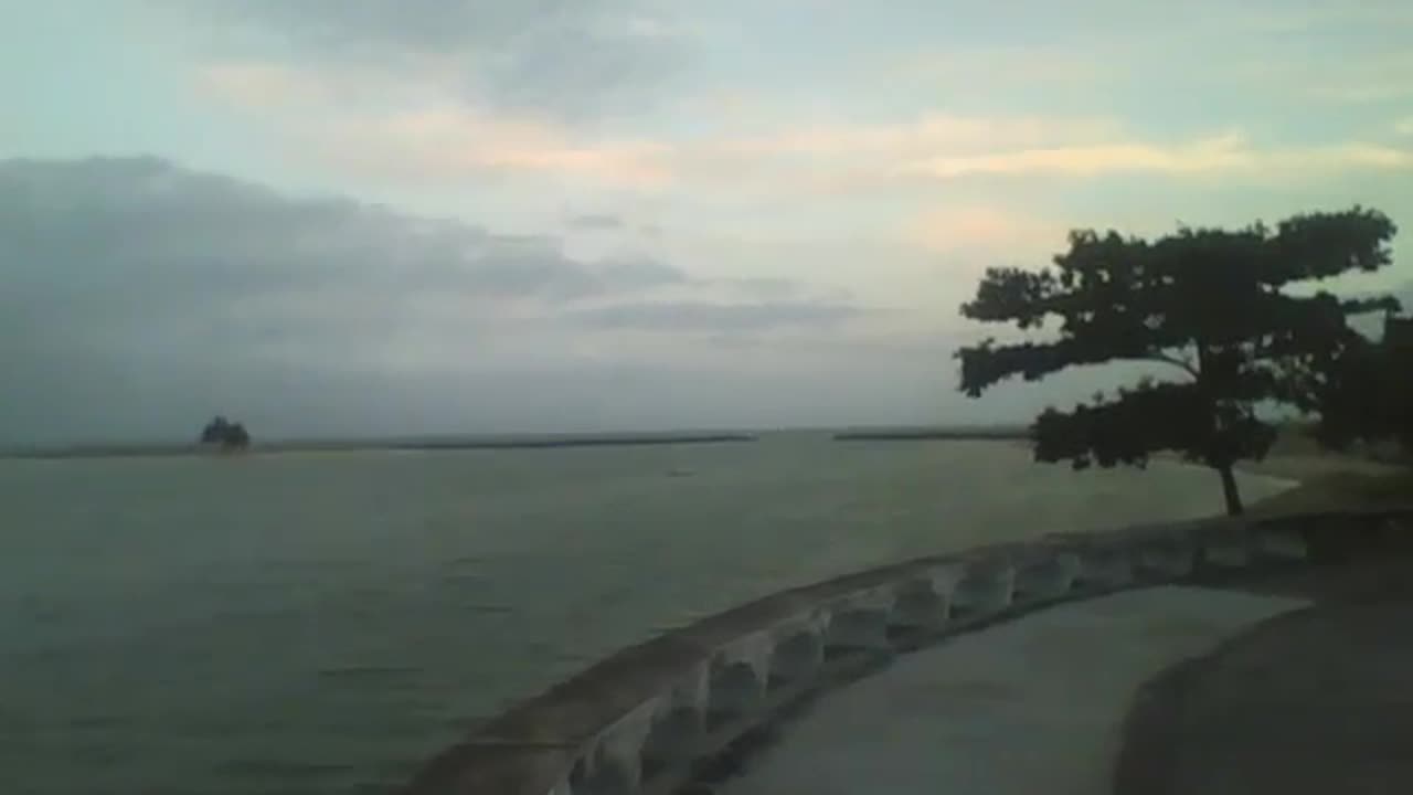 A wonderful view of the sea coast at dusk, beach, buildings, boats and an island! [Nature & Animals]