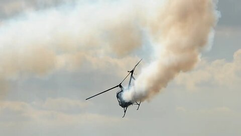 Two die when helicopter crashes into a barge in the Mississippi River