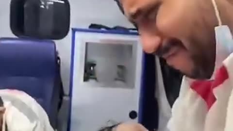 Gaza emergency worker breaks down in tears while cradling baby