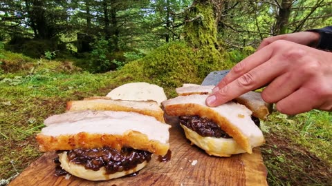 Crispy Pork Belly Burger with caramelized onion cooked over fire