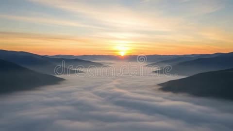 Breathtaking Sunrise Over Foggy Mountain Valley