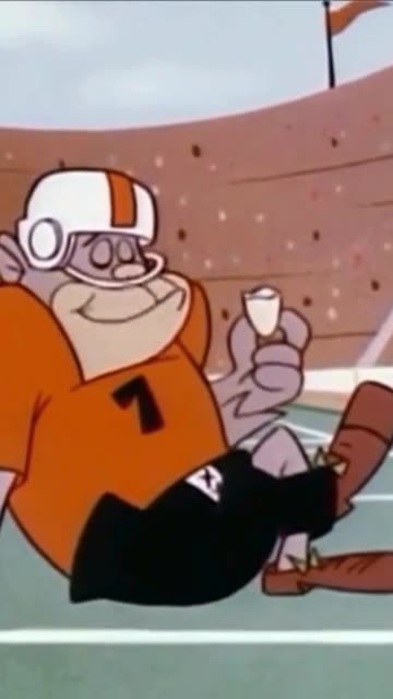 magilla gorilla is eating a banana