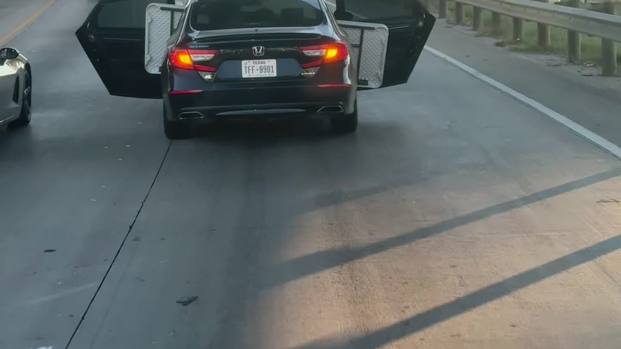 Honda Drives With Doors Open On Highway