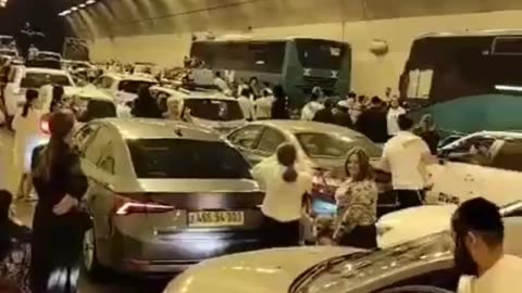 Under missile fire in northern Israel, people pack into a tunnel—and start singing