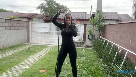 wetlook girl in black tight suit