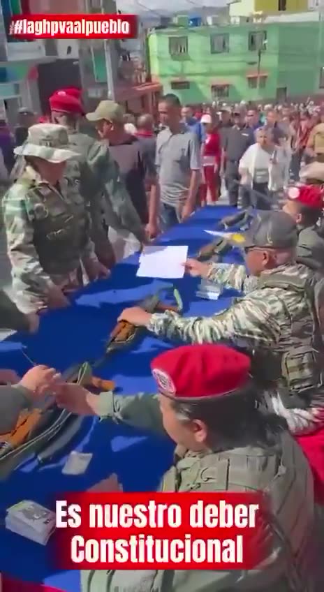 The Venezuelan military has begun distributing rifles to civilians in working-class