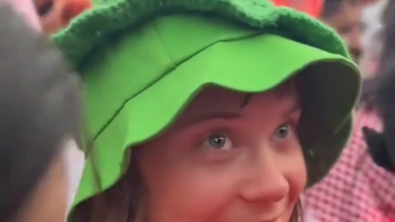Greta wears a frog hat among Muslim men in Tunisia. How would this story end without the cameras?