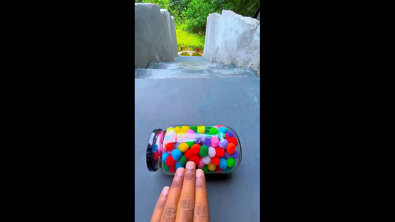 Incredible different colours of bottles falling from stairs to check hardness