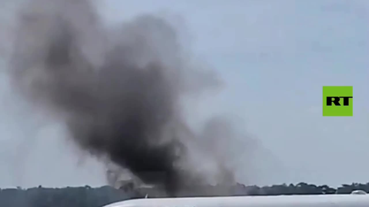 Flames and black smoke coming out of engine