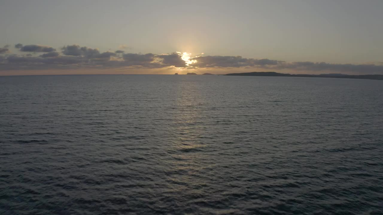 Aerial shot traveling above the sea.