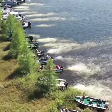 Boat owners moving a large floating island out of the way on Wisconsin's Lake Chippewa.