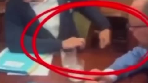 PAY CLOSE ATTENTION TO WHAT HE HIDES UNDER THE TABLE