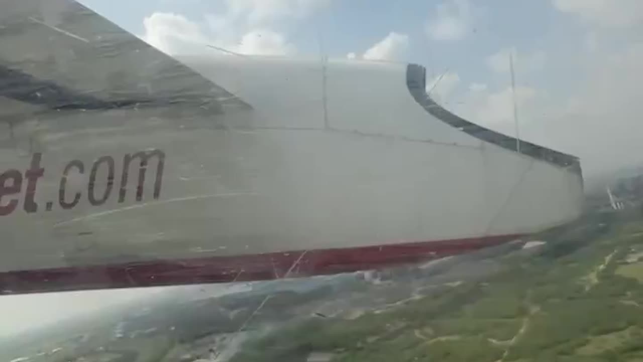 Video of wheel getting detached from aircraft by passenger.